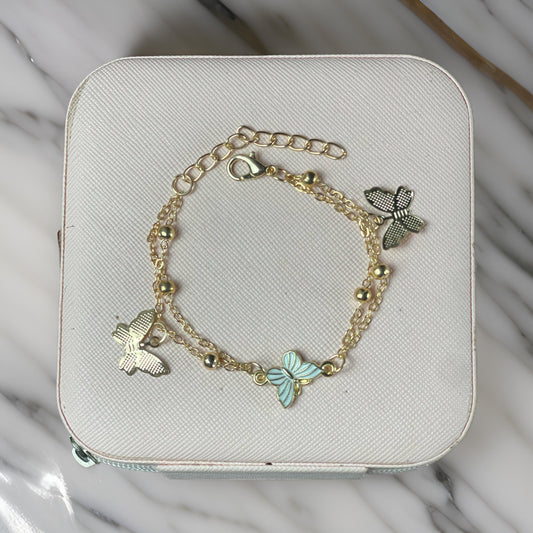 Gold Butterfly Charm Bracelet with Blue Accent and Beaded Details